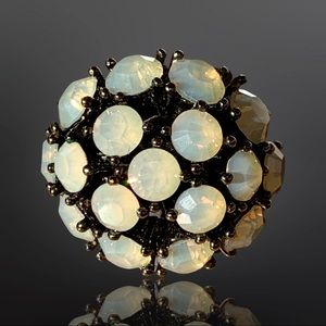 Unique dome-shape ring with opal/iridescent color stones in prong setting